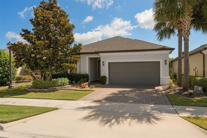 Beautiful Curb Appeal. Please take notice of the Custom Stone Landscape Border Wall.