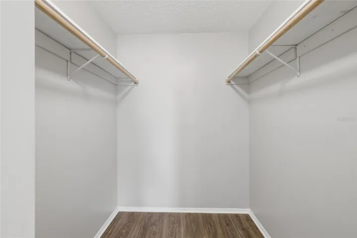 Walk in closet primary bedroom