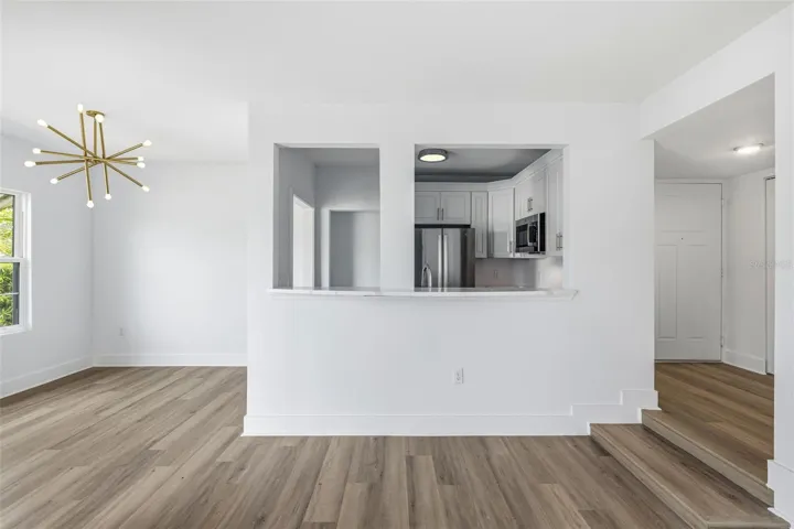 living/dining/kitchen/entryway view