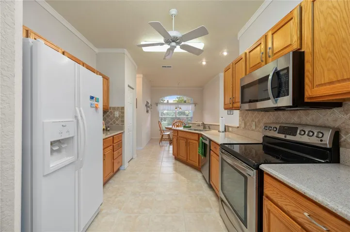 The kitchen features Silestone counters, lower cabinet pull-outs