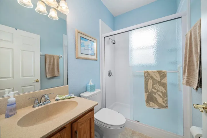 Guest bath has newly installed shower with glass doors