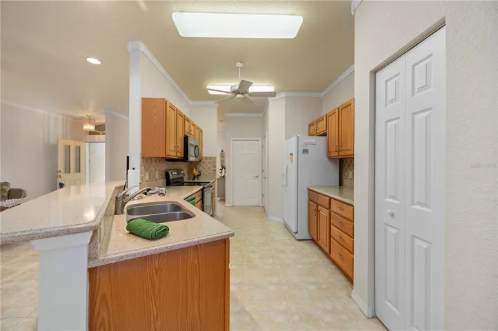 Kitchen crown molding, access to garage and laundry
