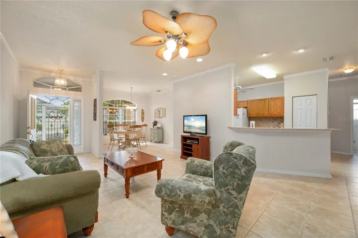 The front dining is open to Living and Kitchen