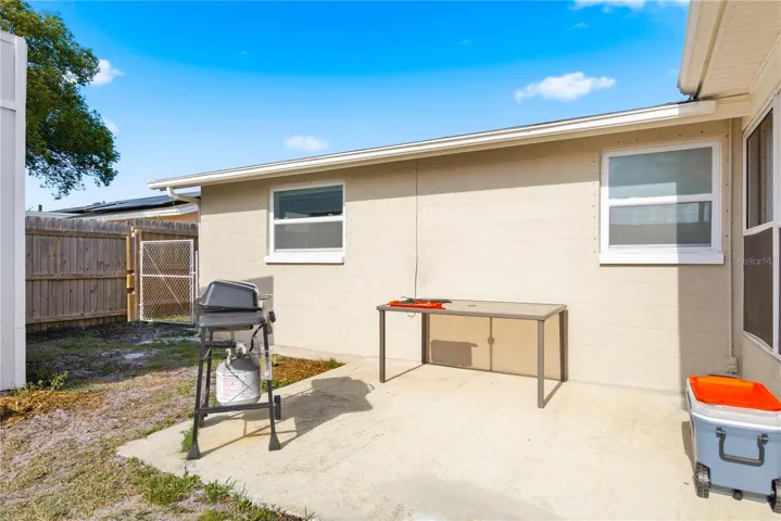 One backyard patio near shed