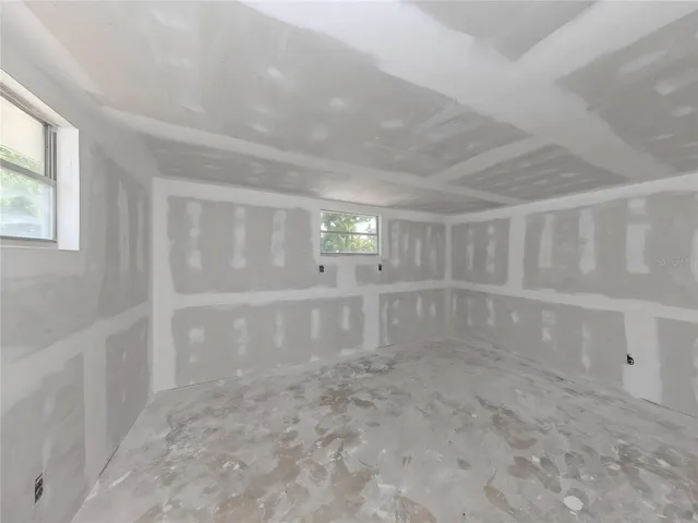 Detached access storage room under the main roof. Ready to be finished for your specific use.