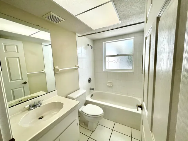 Guest Bathroom with tub/shower.  The Linen closet is in the hall