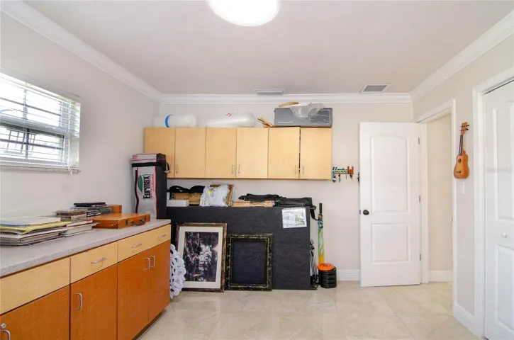 4th bedroom with natural light enhanced by a skylight, creating a bright and inviting atmosphere.