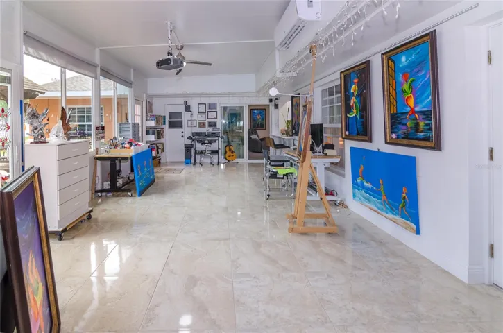 Generous Florida room offering valuable additional living space, perfect for work or relaxation.