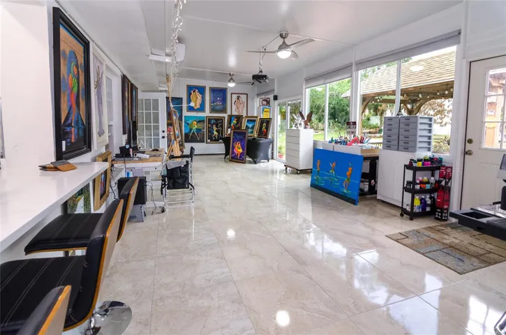 Generous Florida room offering valuable additional living space, perfect for work or relaxation.