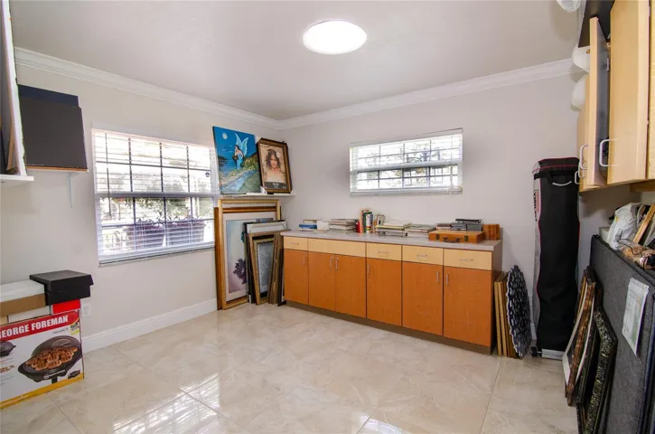 4th bedroom with natural light enhanced by a skylight, creating a bright and inviting atmosphere.