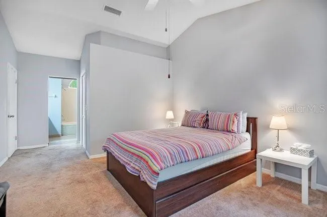 Spacious primary bedroom with abundant natural light.