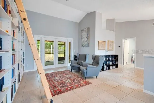 Additional view of the living room with custom built-in bookcase detail.
