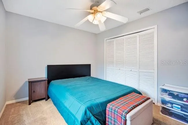 Spacious secondary bedroom with natural light and flexible use.
