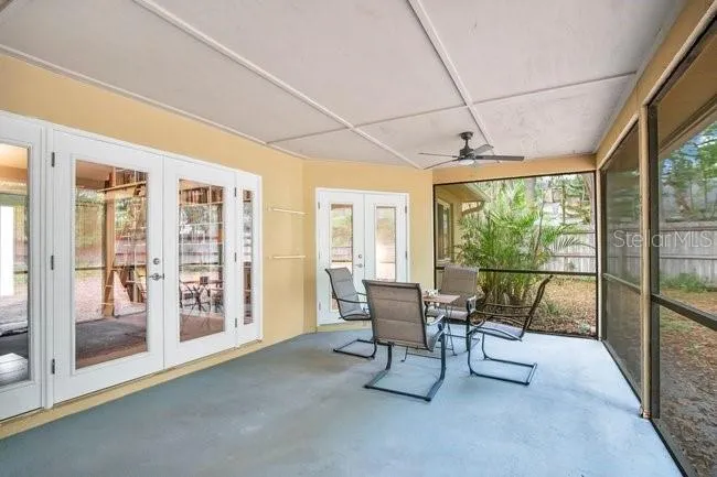Large lanai offering comfortable space for outdoor dining and relaxation.