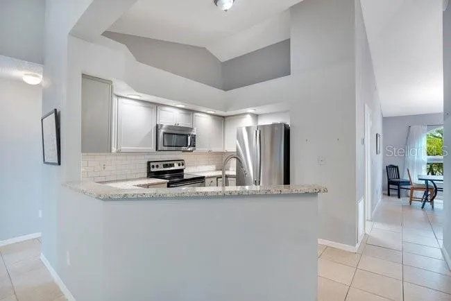 Kitchen with granite countertops and open layout.
