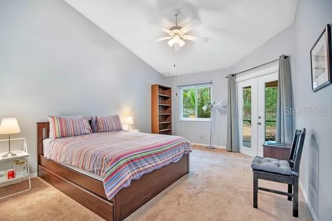 Spacious primary bedroom with private access to the lanai—perfect for relaxing.