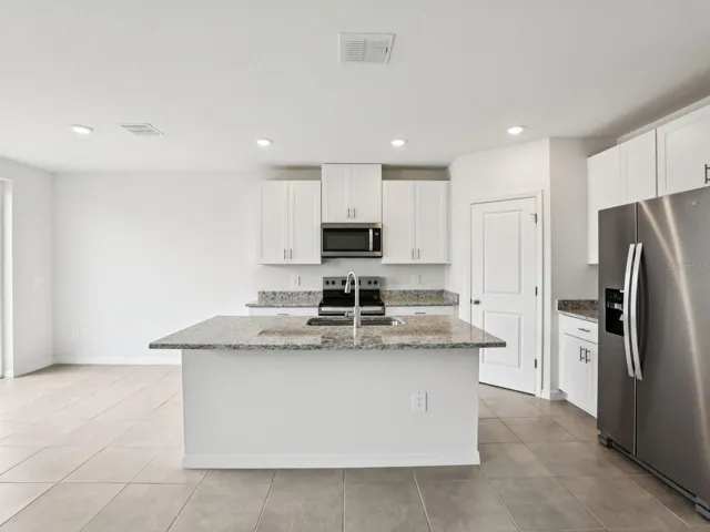 Interior photos are not of the actual home but are photos of the builder home with the same floorplan with similar interior finishes and features.