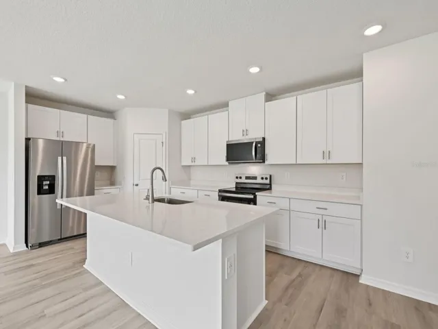 Interior photos are not of the actual home but are photos of the builder home with the same floorplan with similar interior finishes and features.