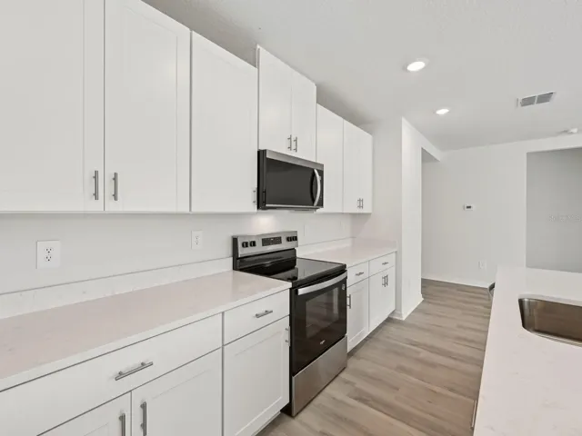Interior photos are not of the actual home but are photos of the builder home with the same floorplan with similar interior finishes and features.