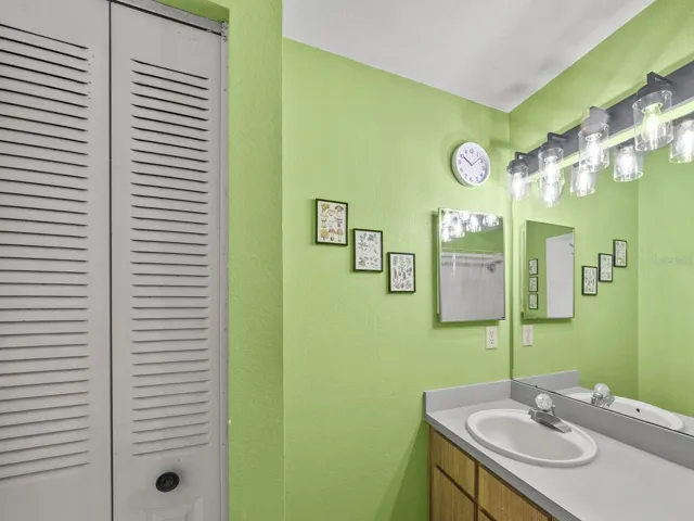 Primary bathroom with vanity and great storage.
