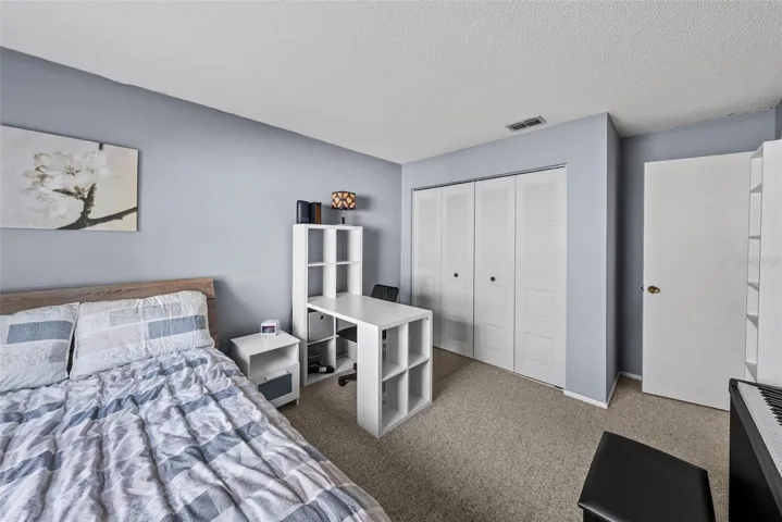 Secondary bedroom with closet storage and flexible layout.