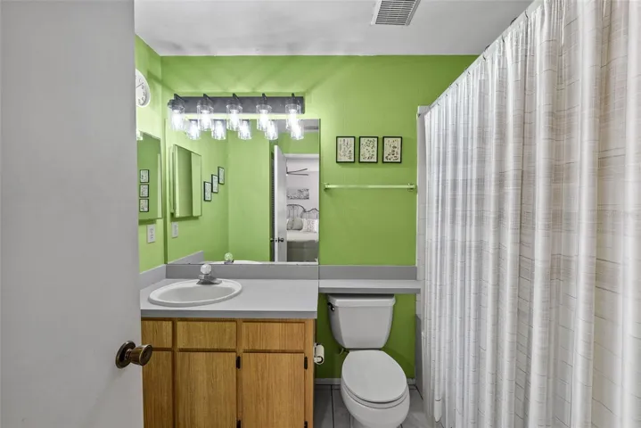 Primary bathroom with vanity and great storage.