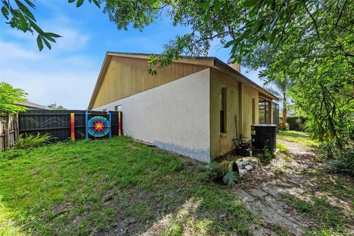 Side yard with fenced area and room for outdoor use.