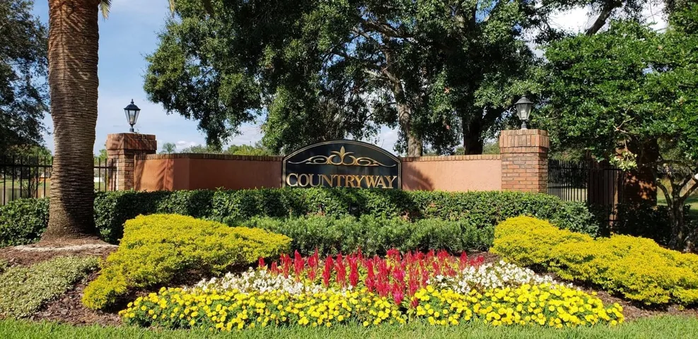 Countryway entrance with beautifully maintained community landscaping.