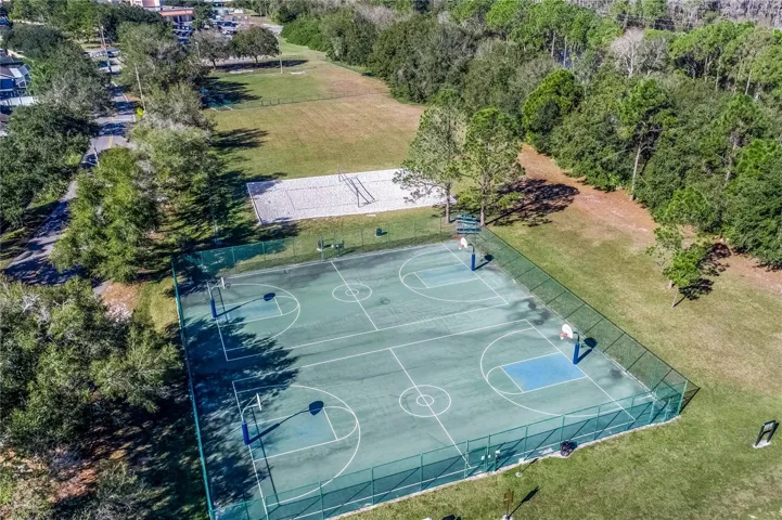 Aerial view of community basketball courts and open green space.