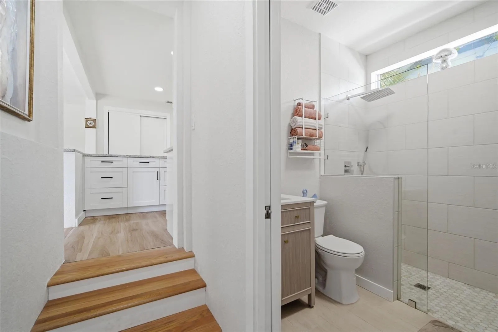Master Suite Bathroom Leading to kitchen area.