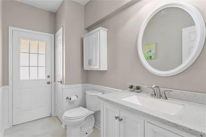 First floor pool half bath with quartz counters