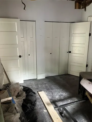 Primary bedroom has full wall of closets.