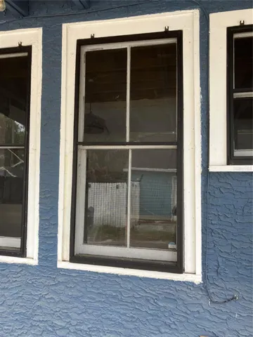 If you were wondering what the hooks at the top of the window are - they hold in the screens. Rare to find screens on these older homes.