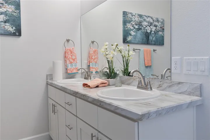 One or more photos may be virtually staged. Actual home shown; finishes, colors, and features may vary.