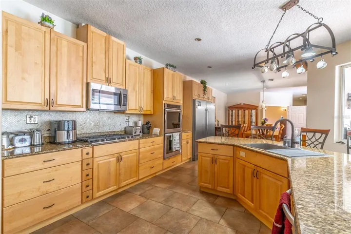 Beautiful updated kitchen with pecan wood cabinets with plenty of storage!