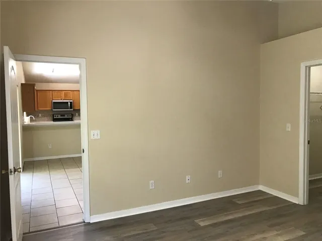 Primary bedroom walk-in closet you can see on the right and walks out to kitchen/living room and lanai