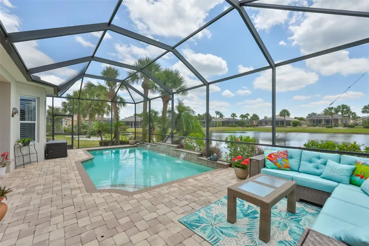 Exquisite Pool Home with fountains, which has both Water Front and a Golf Course View (to the right).