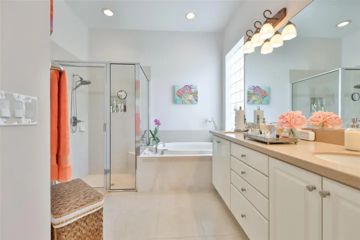 The bathroom boasts of a walk in closet, dual sinks, soaker tub, large shower and private water closet.
