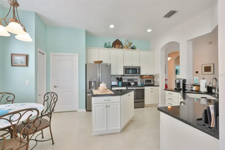 Kitchen is beautifully updated and spacious, with plenty of room for multiple cooks and an eat-in space.