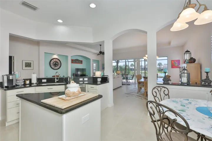 From the kitchen you have a perfect view of the lanai, the pool and the water.