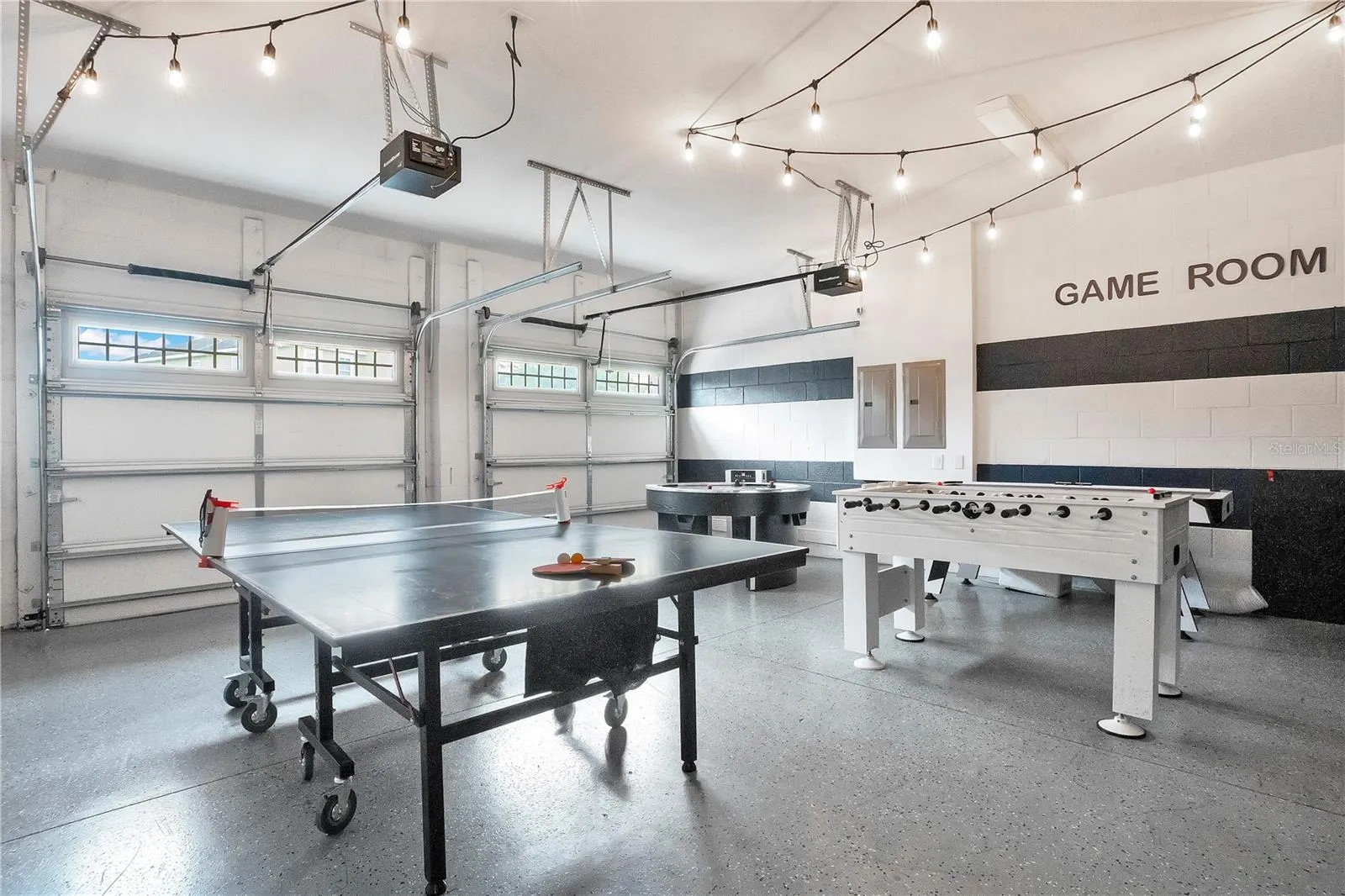 Large game room with multiple entertainment zones designed for unforgettable guest experiences