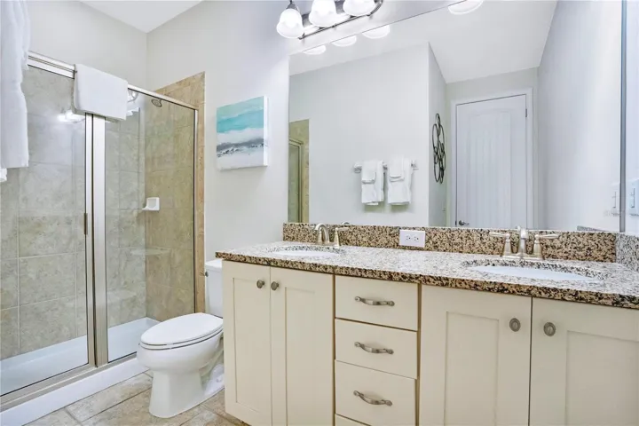 Private ensuite bath (#9) with clean modern finishes and generous vanity space