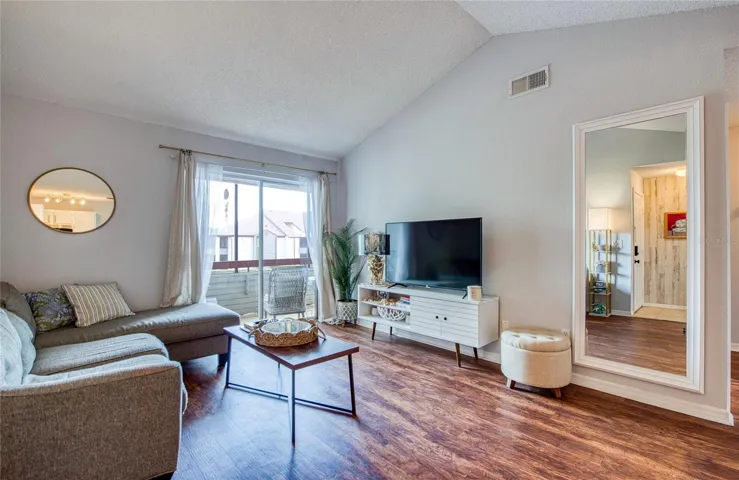 Vaulted Ceilings w/ Balcony Access from Living Area
