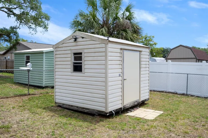Left Side of Backyard & Pool Cage