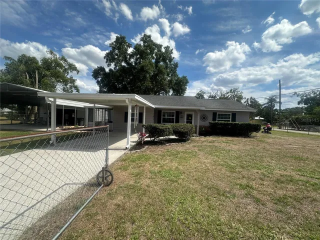 Front of house with carport 1