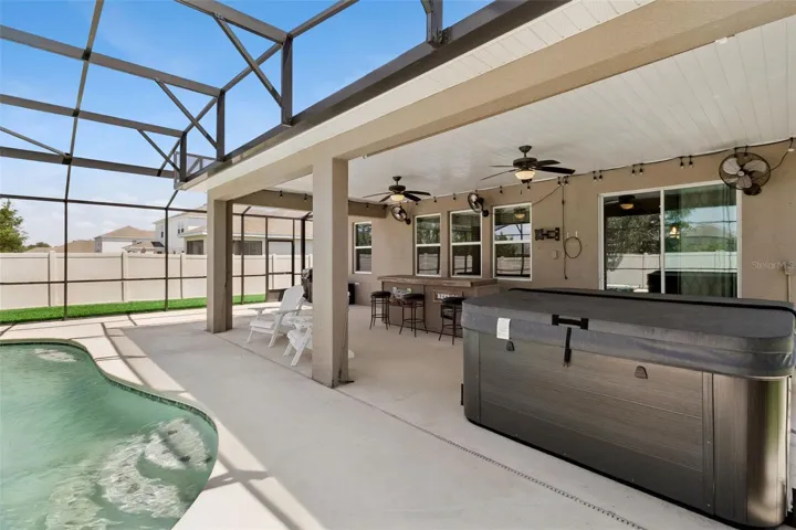 Covered lanai with pool enclosure.