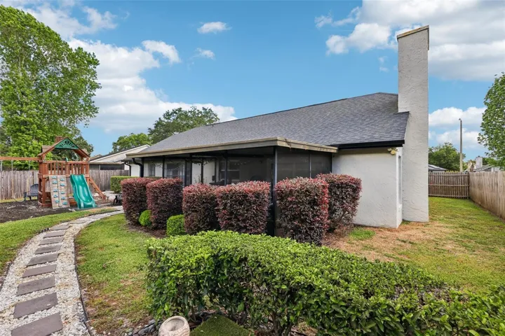 Fully fenced backyard, mature landscaping.