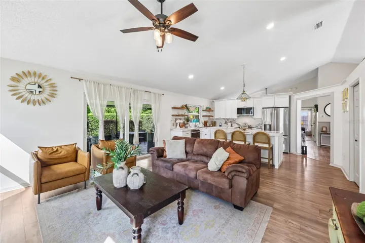 Kitchen is open to a light filled family room, complete with a vaulted ceiling.