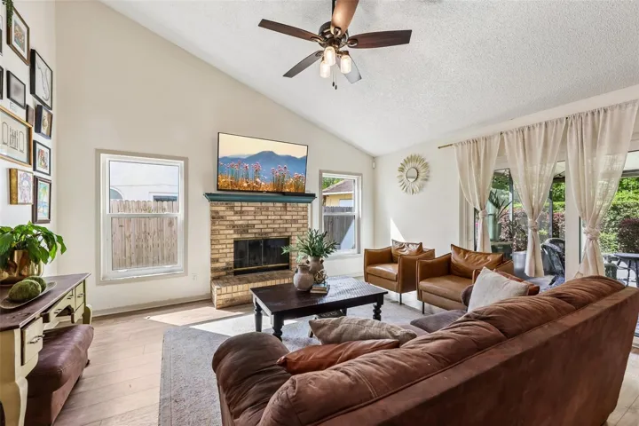 Sliding glass doors open up to a large screened lanai for seamless indoor/outdoor living.