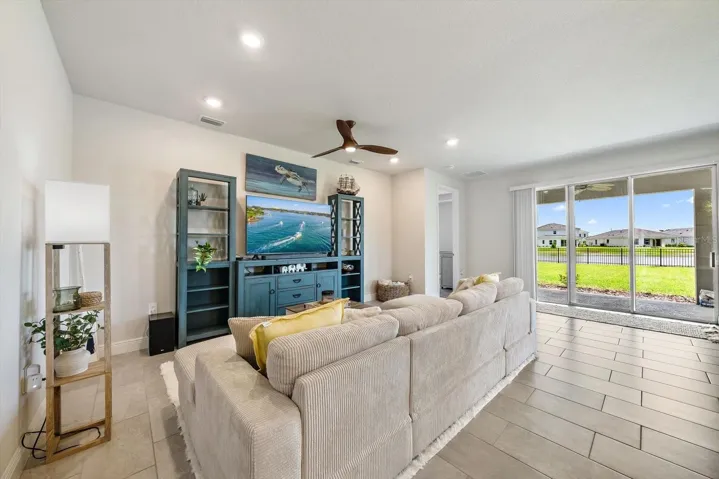 Living Space with Sliding Doors to Covered Patio view of Pond